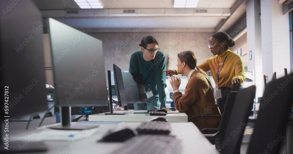 Poster Team of Diverse Female and Male Students Having a Conversation in Computer Class, Working on a College Assignment. Young Classmates Talking, Thinking About a Successful Software Development Project