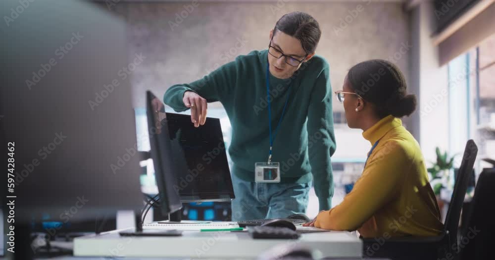 Poster Diverse Multiethnic Team of Two Students Chatting in Computer Class, Preparing for Exams in School. Young Software Developers Talking About Creating an Online Research Project About AI Safety
