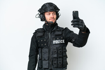 Fototapeta premium SWAT man over isolated white background making a selfie