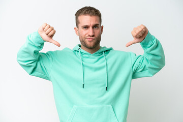 Young handsome caucasian man isolated on white background proud and self-satisfied