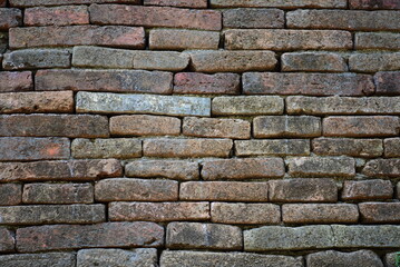 Obraz premium The ancient city wall was built of bricks. Can be used as a vintage background
