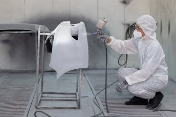 Garage car color repair painting wax airbrush coating team staff working in auto workshop