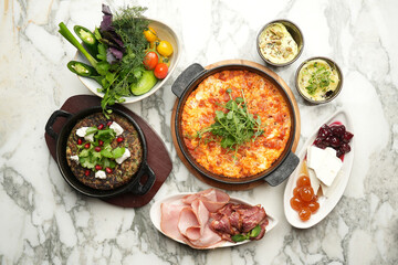 Traditional turkish breakfast menu with shakshuka in frying pan