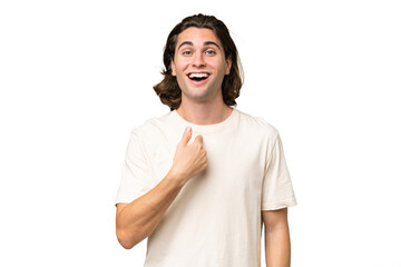 Young caucasian man isolated on green chroma background with surprise facial expression