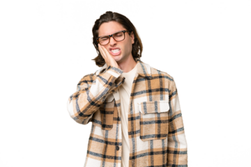 Young caucasian man isolated on green chroma background with toothache