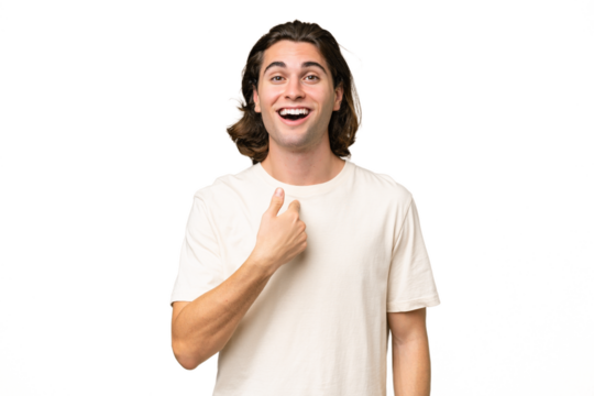 Young caucasian man isolated on green chroma background with surprise facial expression