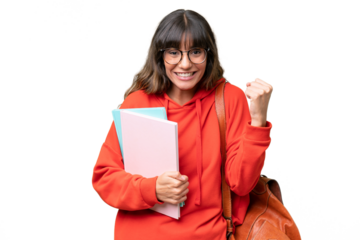Young student caucasian woman over isolated background celebrating a victory in winner position