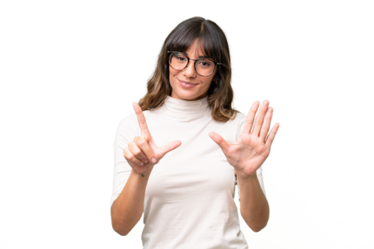 Young caucasian woman over isolated background counting seven with fingers