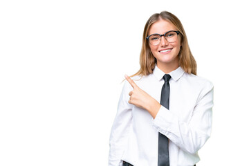 Young business caucasian woman over isolated background pointing to the side to present a product