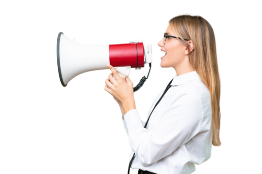 Young business caucasian woman over isolated background shouting through a megaphone