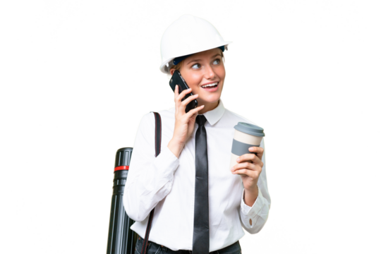 Young architect caucasian woman with helmet and holding blueprints over isolated background holding coffee to take away and a mobile
