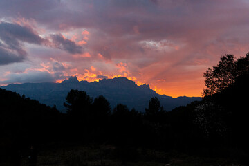 Sunset with red sky overlooking the Montserrat mountain