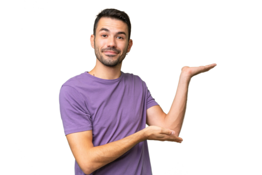 Young handsome caucasian man over isolated background extending hands to the side for inviting to come