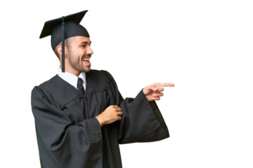 Young university graduate man over isolated background pointing finger to the side and presenting a product