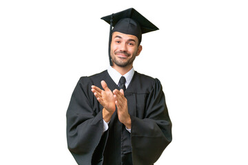 Young university graduate man over isolated background applauding after presentation in a conference