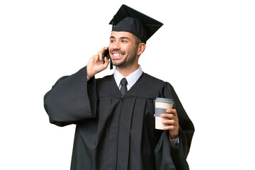 Young university graduate man over isolated background holding coffee to take away and a mobile