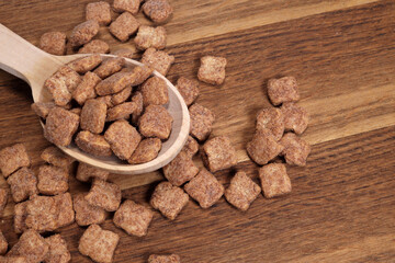 Chocolate snacks, dry breakfast, pads in wooden spoon