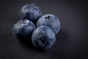 Blueberries on stone plate background