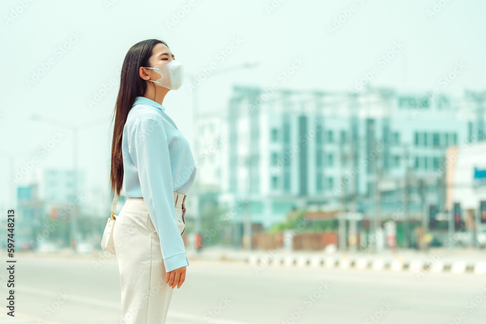 Wall mural asian women wearing protection mask feels headaches and cough due to air pollution pm 2.5 air pollut