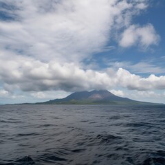 Clouds above a volcano in the middle of the sea.