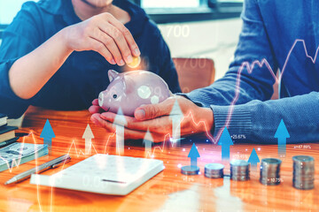 Saving money concept Business man hand putting Row and coin finance and banking on digital stock market financial exchange analyzing forex trading graph financial data.