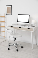 Workplace with comfortable office chair indoors. Interior design