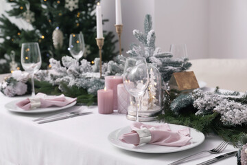 Beautiful table setting with Christmas decor indoors