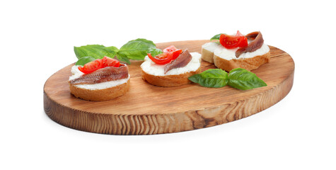 Delicious sandwiches with cream cheese, anchovies, tomatoes and basil on white background