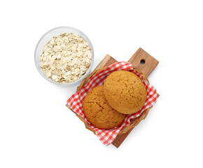 Delicious oatmeal cookies and flakes on white background, top view