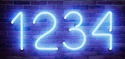 Glowing neon number (1, 2, 3, 4) signs on brick wall