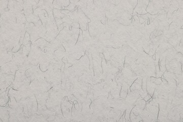 Texture of light grey paper sheet as background, top view