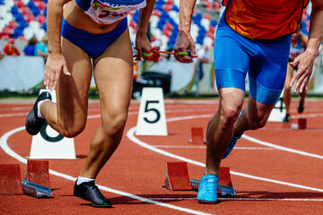 female blind para athlete runner with male guide start running race, summer para athletics...