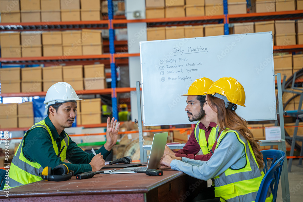 Poster group of warehouse workers have a briefing in a large distribution center,concept of teamwork and oc