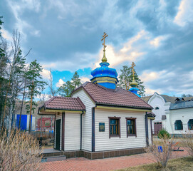Fototapeta na wymiar A small church on the territory of the Holy Dormition Monastery. Krasnoyarsk