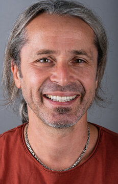 Portrait of mature european man. Smiling handsome man with hazel eyes.