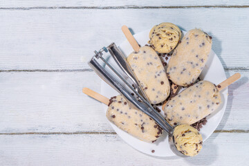 Edible raw cookie dough popsicle ice cream. Homemade popsicle lollipops with frozen edible raw...