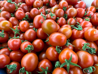 Tomatoes. Heap of organic cherry tomatoes. close up. food background. Top view