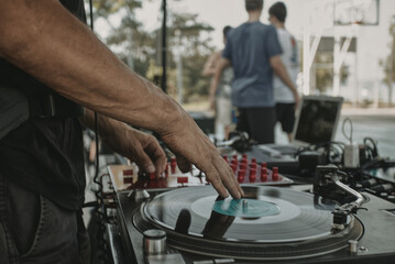 DJ playing music at the outdoor party