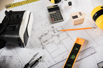 Architect workplace top view. Architectural blueprint paper project plans on desk table, tool for engineer contractor building design working drawing and VR glasses, industry virtual technology