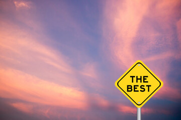 Yellow transportation sign with word the best on violet color sky background