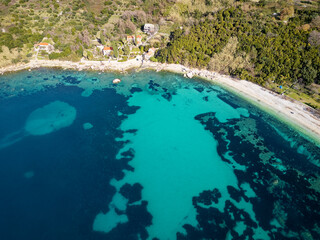 Aerial drone view of a beautiful sunny coastal area. Holidays and vacation time. Summertime. Relax concept. Beach. 