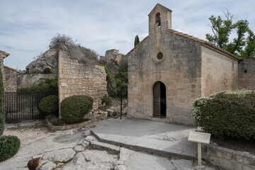 Fototapeta na wymiar Baux-De-Provence, France - 04 21 2023: View of a typical Saint Blaise Chapel in a village in Provence.
