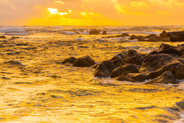 Waves Washing Over Ancient Lava Boulders on Lydgate Beach at Lydgate Beach Park, Lihue, Kauai, Hawaii, USA