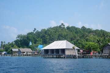 Fototapeta na wymiar Traditional floating house in Sawinggrai Village, Raja Ampat, Indonesia