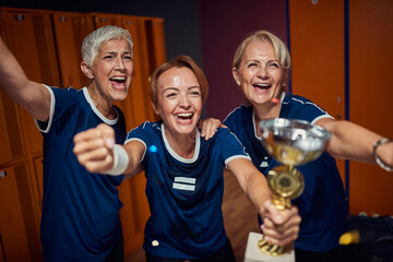 Senior women and young woman together celebrating first place in dressing room.