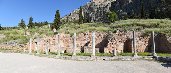 Ancient Roman forum colonnade on the central public space, The Agora, at Sanctuary of Apollo, it was the center of the athletic, artistic, spiritual and political life of the city, Delphi, Greece