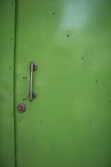 green door with door lock and doorknob design for security concept