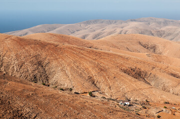 Fototapeta na wymiar View of a volcanic desert area near the sea in Fuerteventura, Canary Islands.