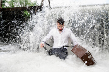 bearded man concentrated with suitcase in water