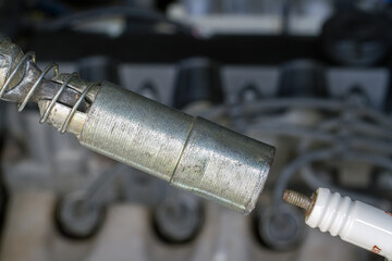 Wrench to replace car spark plugs.